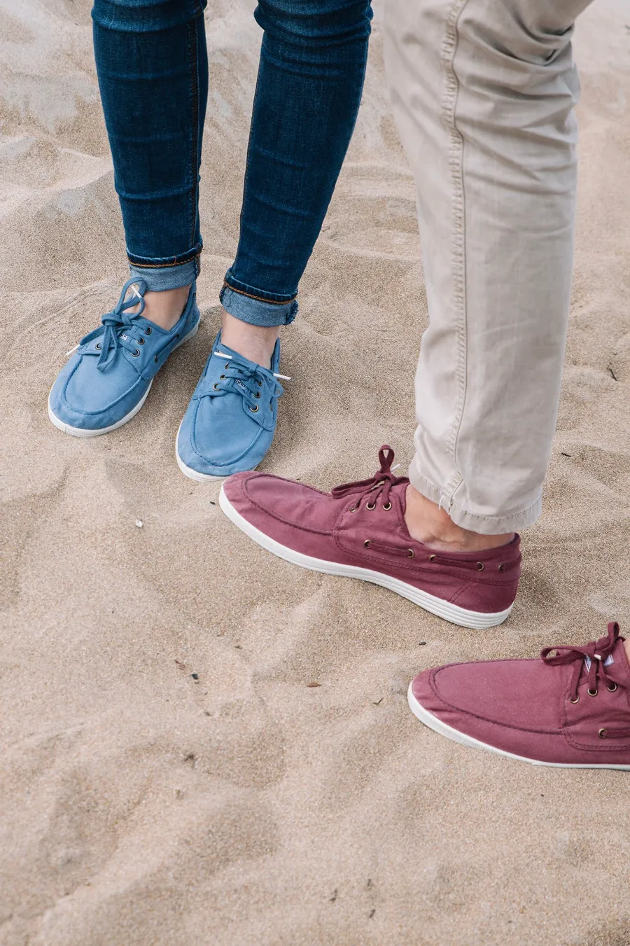 Natural World boat shoes in blue and burgundy on the sand